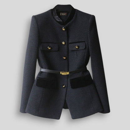 Navy blazer with gold buttons on a light gray background