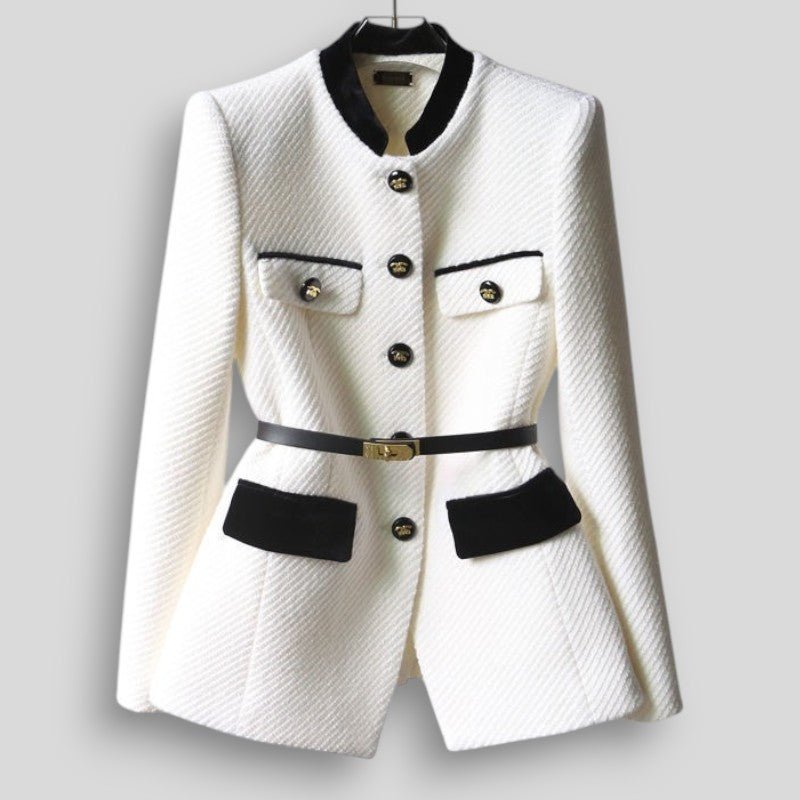 White blazer with black accents on a gray background