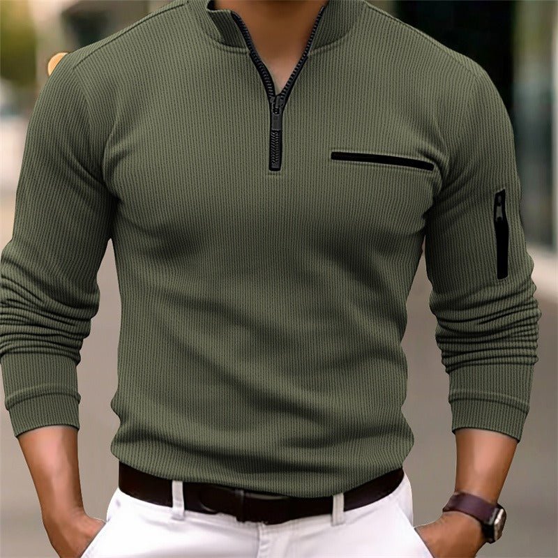 Green long-sleeve shirt with a zipper on a blurred background