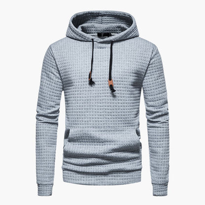 Light blue textured hoodie with a hood on a white background