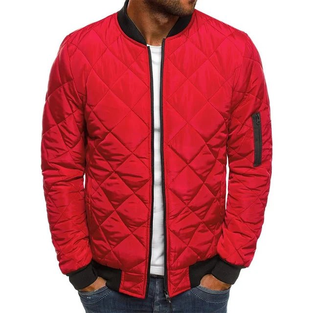 Red quilted jacket worn by a person on a white background