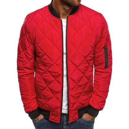 Red quilted jacket worn by a person on a white background
