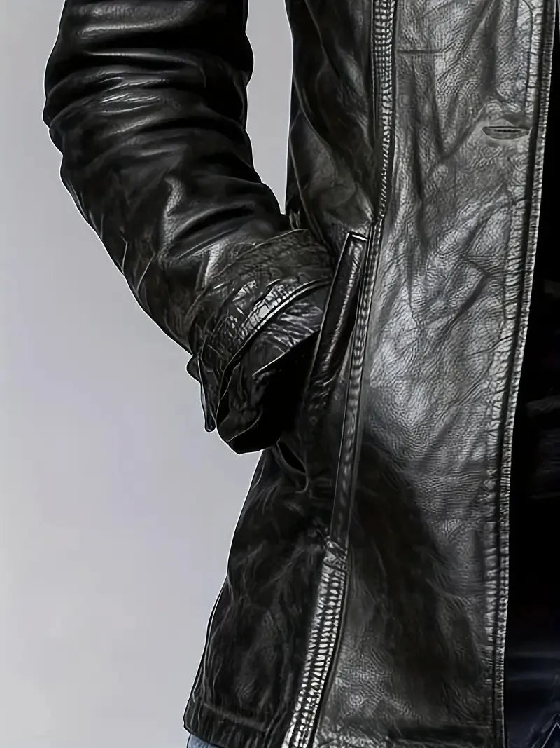Close-up of a black leather jacket with a zipper on a light gray background