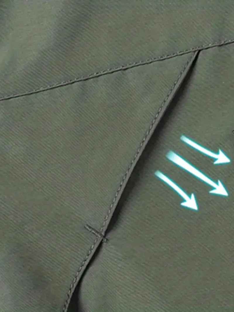 Close-up of green fabric with stitching and a glowing arrow symbol.