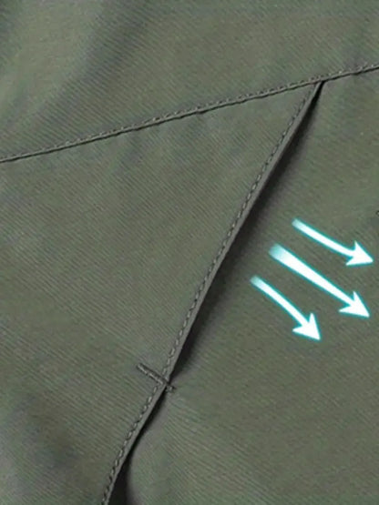 Close-up of green fabric with stitching and a glowing arrow symbol.