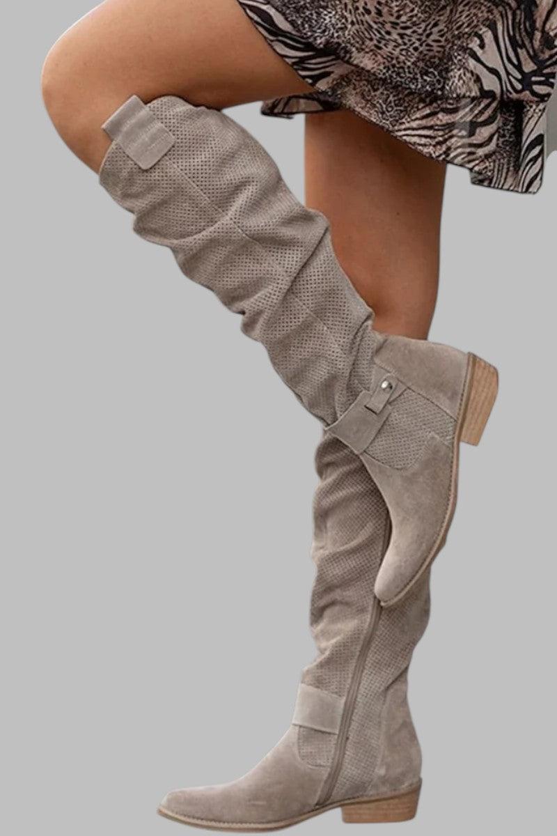 Beige knee-high boot on a gray background