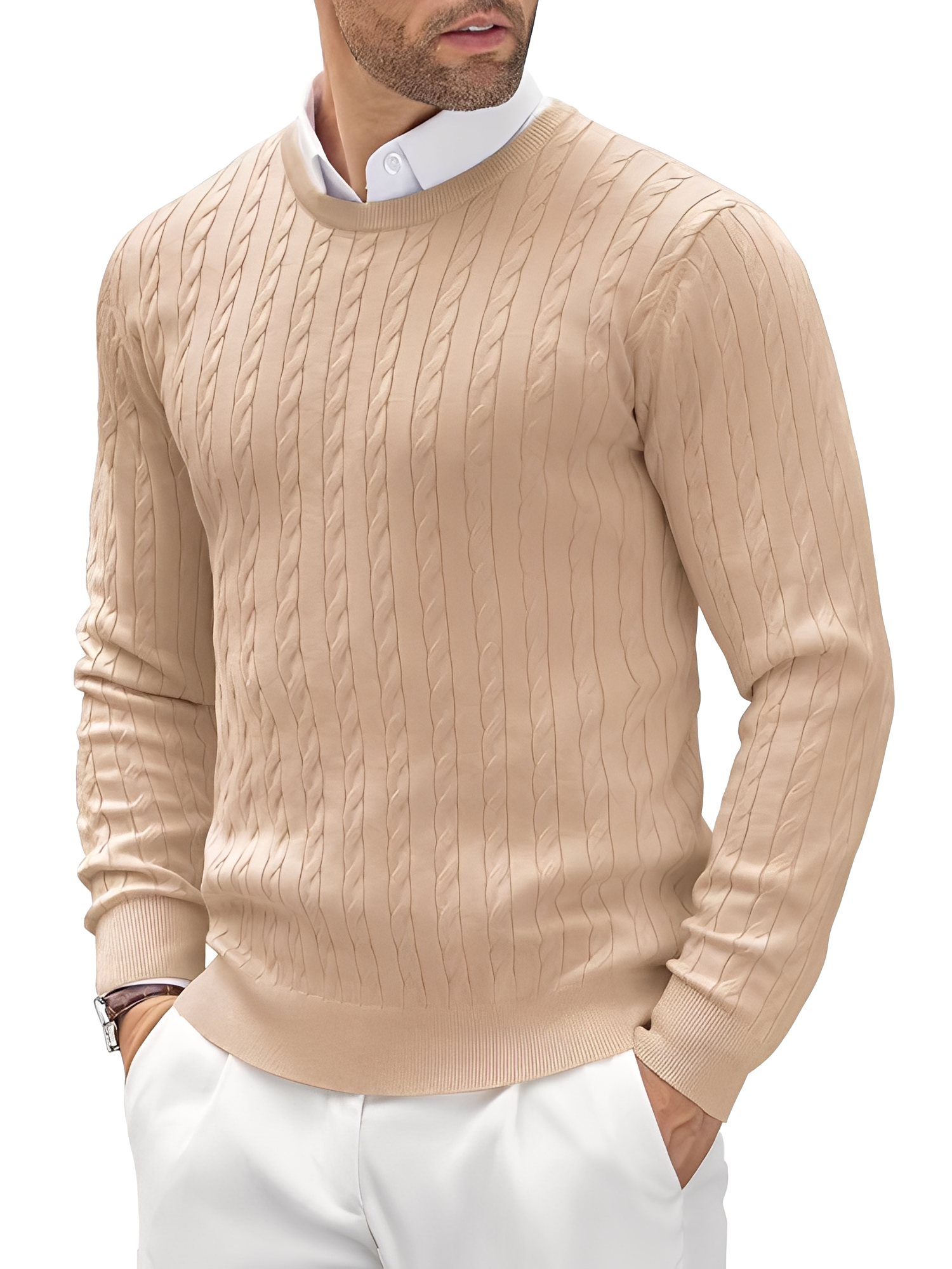 Man wearing a beige cable knit sweater with a white shirt and pants on a white background
